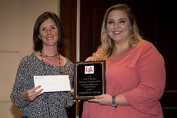 Kim Frank with Baldwin County EMC presents the PowerSouth Academic Scholarship Award to Samantha Darring.