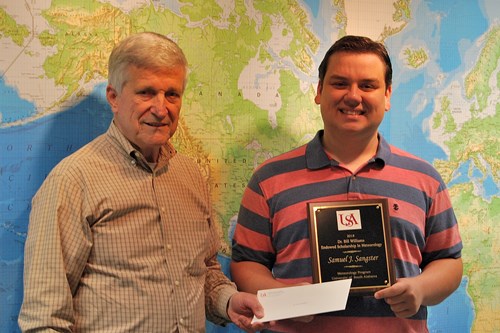 Dr. Bill Williams presents an Endowment Scholarship to Samuel Sangster.