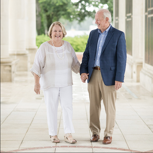 Pam and Eric Patterson walking at the Moulton Tower.