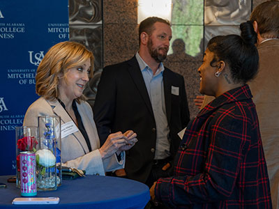 Real Estate agent speaking with student in Real Estate program.