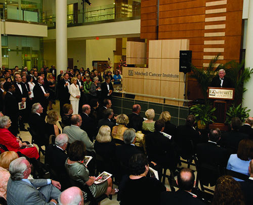 Group at Mitchell Cancer Institute with President Moulton speaking.