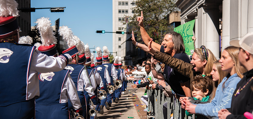 Fans with jaguar marching band