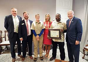 Alfred Lynaum with Dr. Kent, President Jo Bonner, and management team.