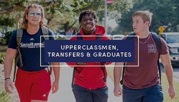 Three male students walking to class