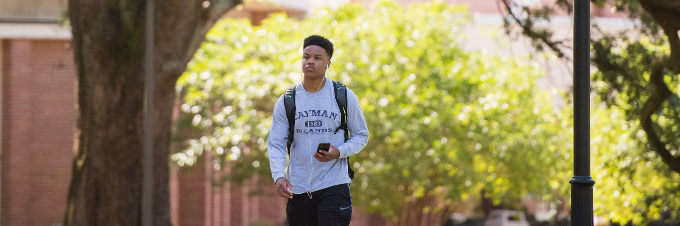 Male student walkingon campus