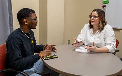 Student meeting with staff at Involvement Advising.