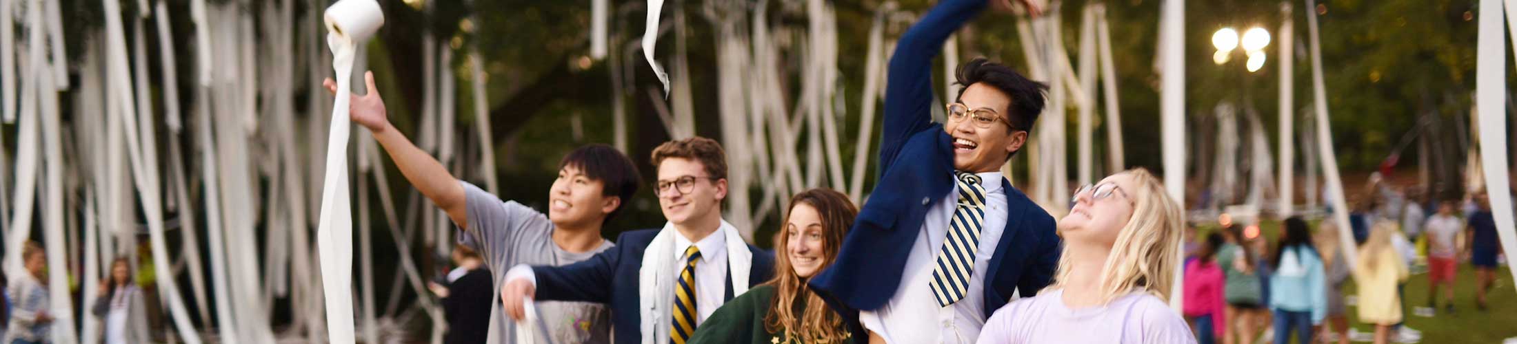 Students throwing toilet paper at Junk the Jungle.