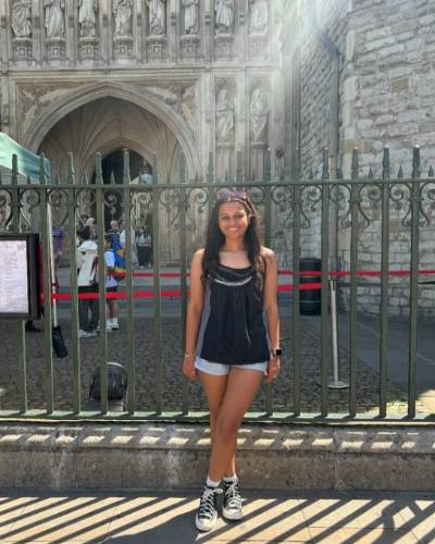 Woman Standing in front of gates