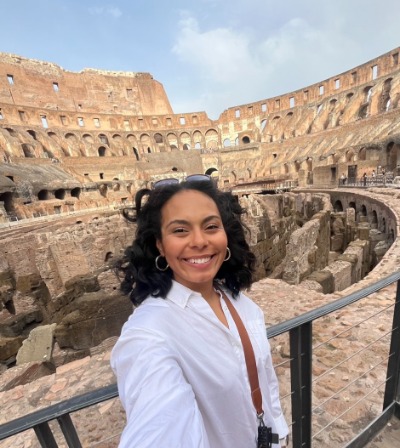 Destani standing in front of the Colliseum in Italy