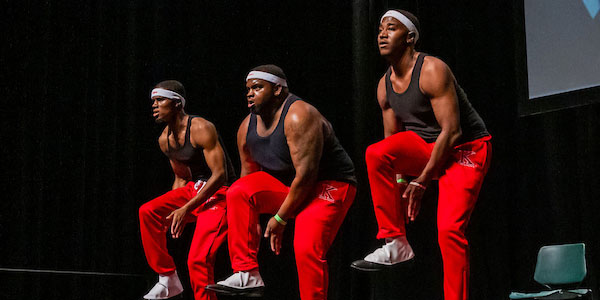 Jag students at step show performing on stage.